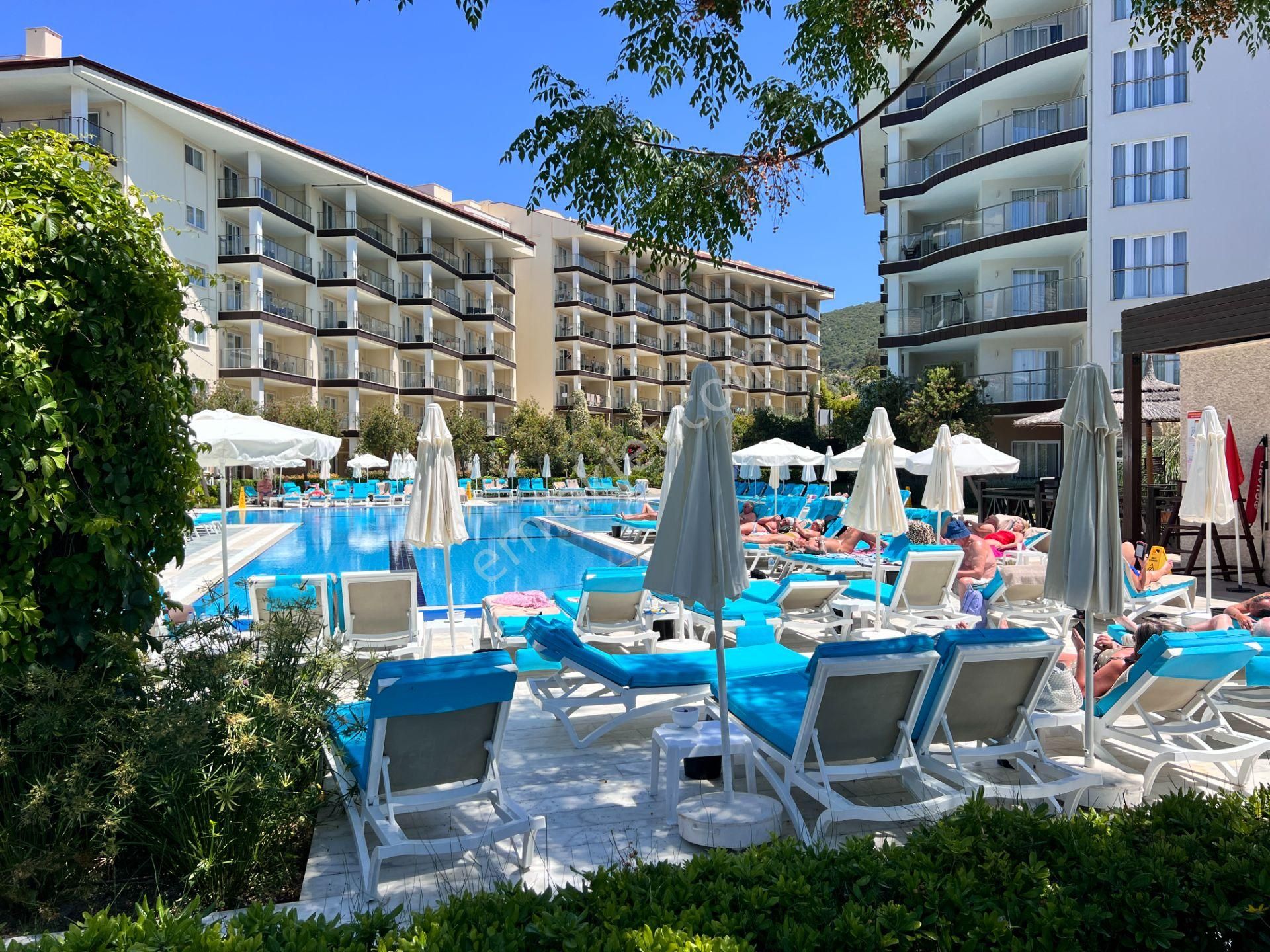 Kuşadası Türkmen Satılık Daire  Kuşadası,Ramada resort,deniz manzaralı,2 odalı,kira garantili 