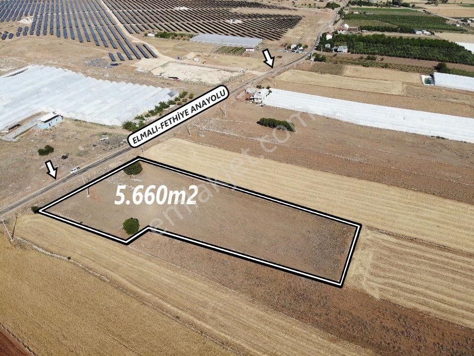 Elmalı Kışla Satılık Tarla  ANTALYA ELMALI KIŞLA MAH'DE FETHİYE ANAYOLUNA CEPHE TİCARET YAPIMINA UYGUN 5.660m2 SATILIK TARLA