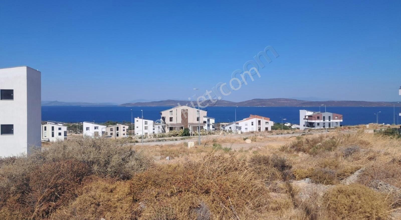 Karaburun Mordoğan Satılık Villa İmarlı MORDOGAN KAMUKENTTE 2.5 KAT IMARLI DENIZ MANZARALİ ARSA