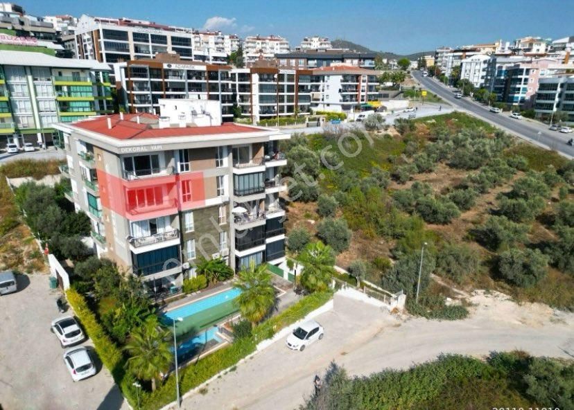 Kuşadası İkiçeşmelik Satılık Daire  KUŞADASI'NDA HAVUZLU, KAPALI GARAJLI ARA KAT SATILIK 2+1 DAİRE