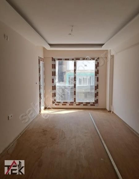 Bayraklı R. Şevket İnce Satılık Daire ŞEHİR HASTANESİ KARŞISINDA SIFIR GENİŞ 2+1 90m2 ARA KAT