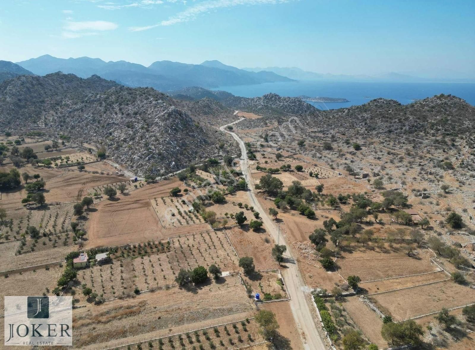 Marmaris Taşlıca Satılık Tarla Joker: Marmaris Taşlıca Serçe Yolunda Yola Cepheli Düzlük Tarla