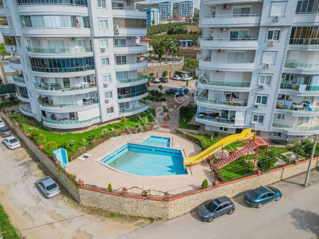 Alanya Mahmutlar Satılık Daire  ALANYA MAHMUTLAR 2+1 120M2 EŞYALI DENİZ MANZARALI HAVUZLU DAİRE