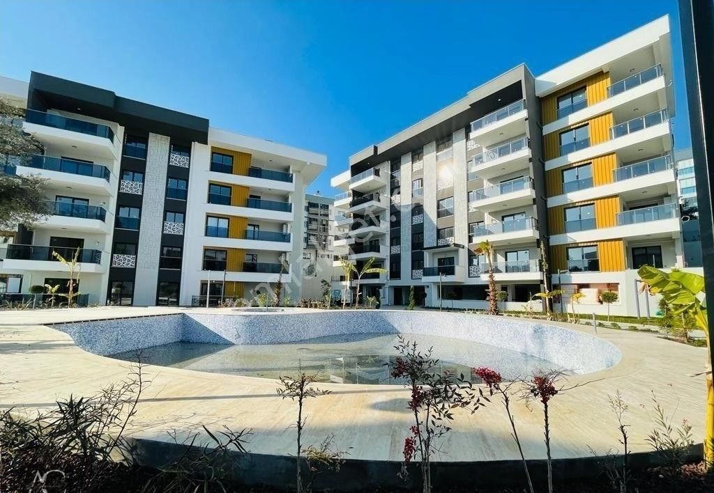 Kuşadası İkiçeşmelik Satılık Daire GUVENLIK-ACIK/KAPALI HAVUZ-OTOPARK-HAMAM-SAUNA-YERDEN ISITMA-YENİ-LÜX-FIRSAT DAİRELER