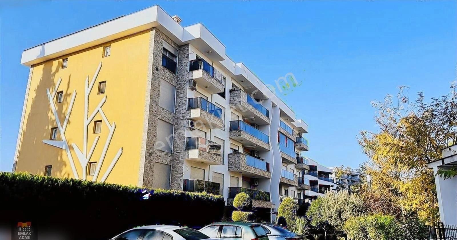 Kuşadası İkiçeşmelik Satılık Daire Kuşadası Merkezde Havuzlu St 2+1 Eşyalı Doğalgazlı Bahçe K.daire