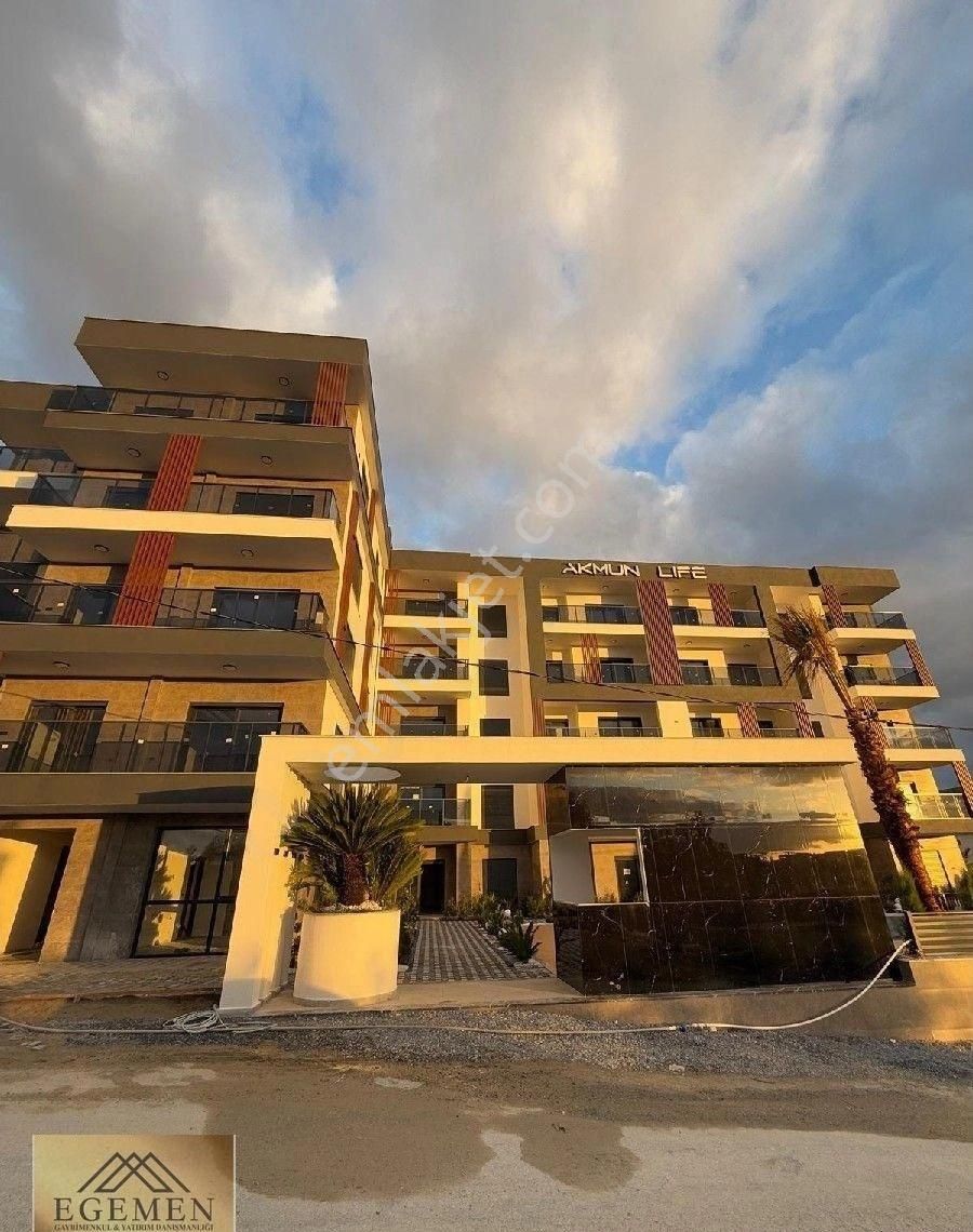 Kuşadası İkiçeşmelik Satılık Daire Kuşadasında Havuzlu,güvenlikli,ısıtma Sistemli Modern Dizayn 2+1daire