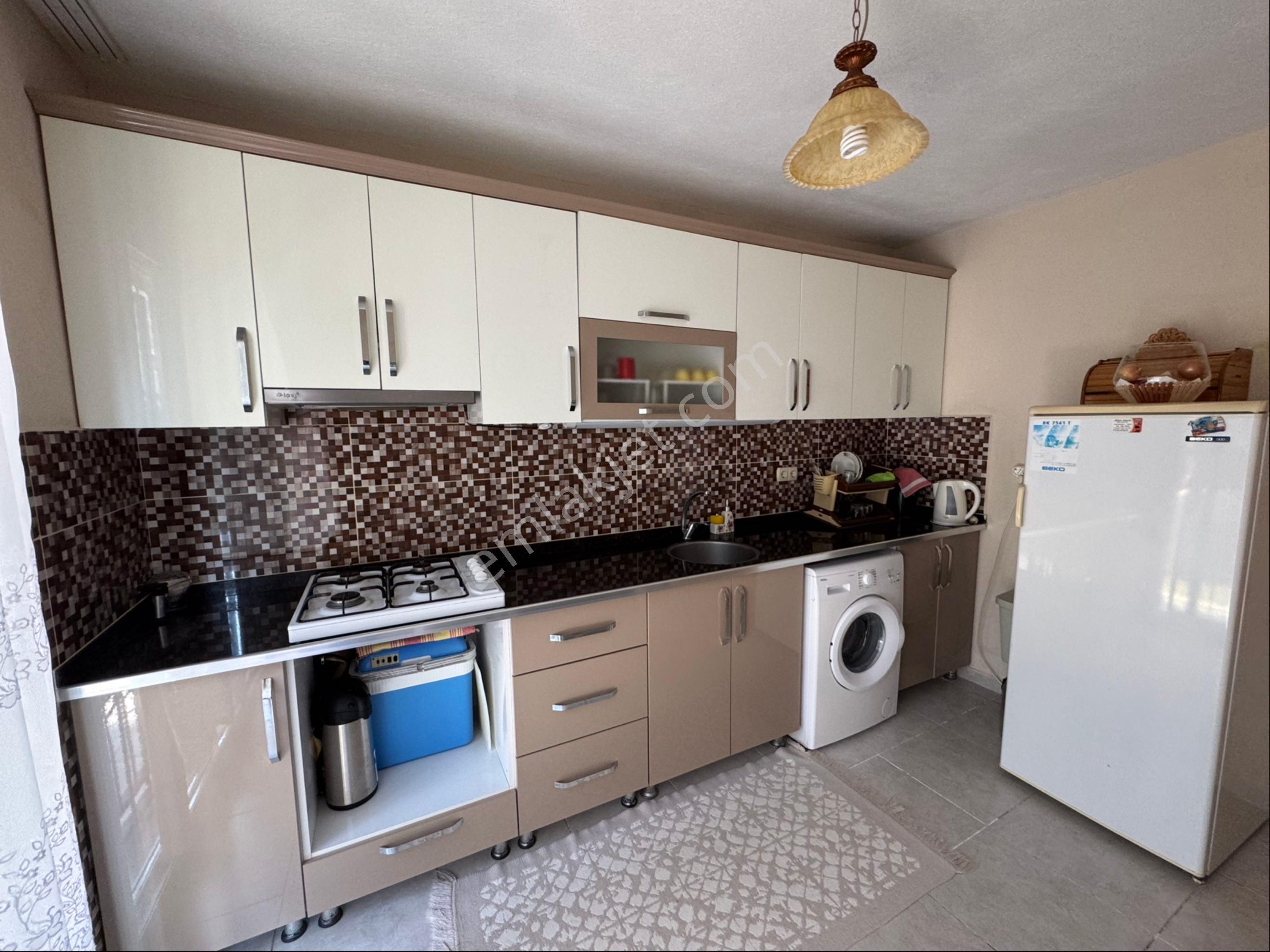 Kuşadası Güzelçamlı'da Satılık Bahçeli 2+1 Ayrı Mutfak Daire