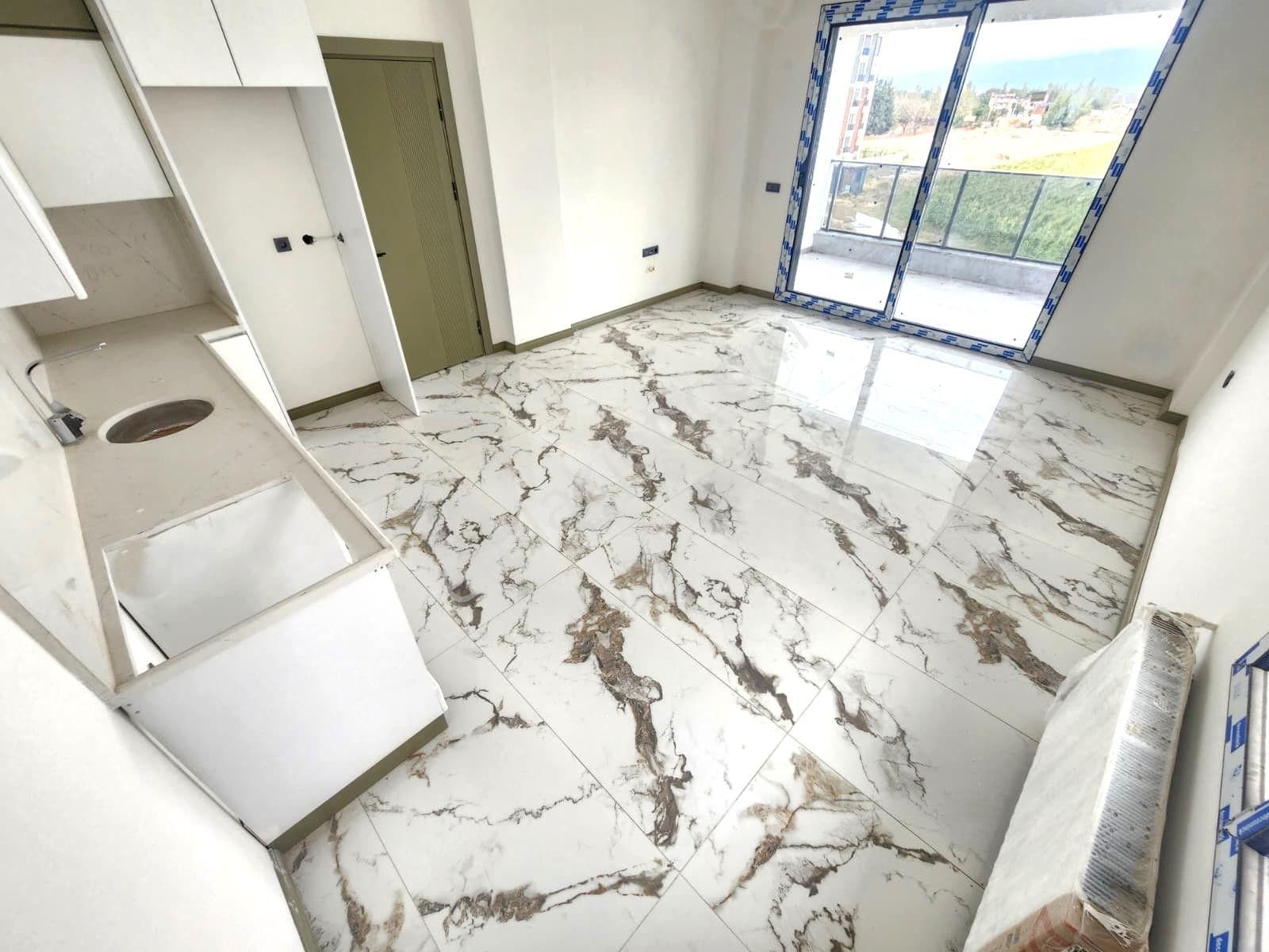 Aygülden Burhaniye Bahçelievler'de Sıfır Kat Ve Cephe Seçenekleriyle Doğalgazlı 1+1 Satılık Daireler