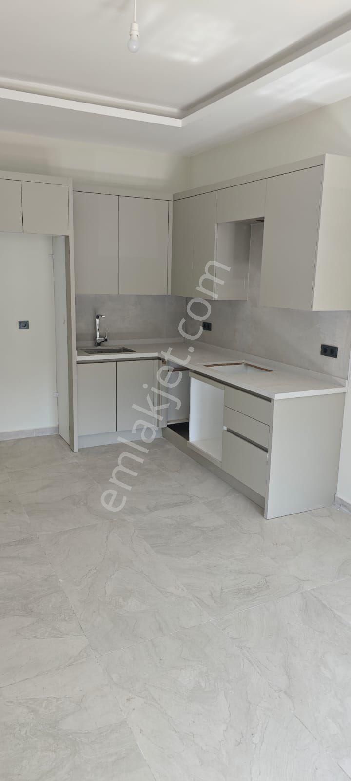 Davutlar'da Merkez'de 1+1 Yerden Isıtmalı Sıfır Satılık Daire - Görsel 4