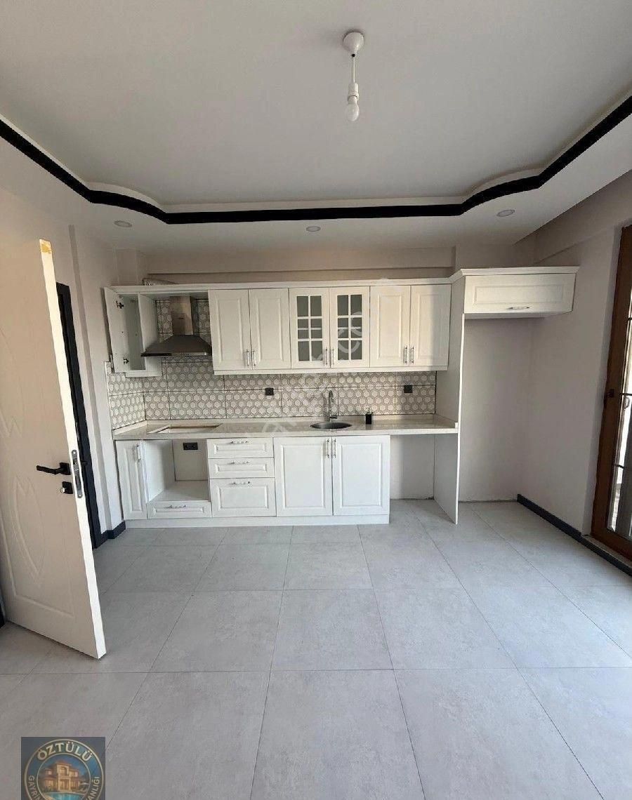 1+1 1.kat Bahçeli Nizam Satılık Daire