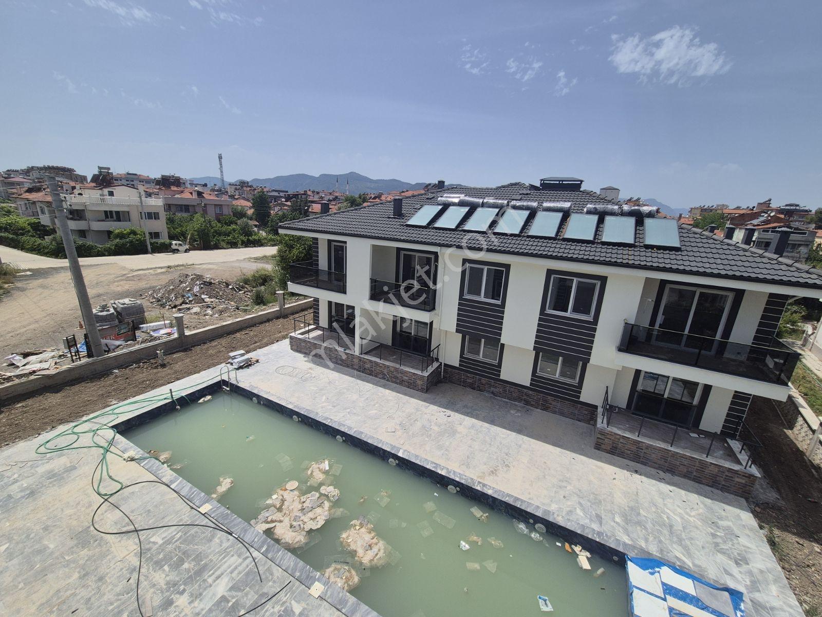 Rotam Emlaktan Ortaca'da Havuzlu Sitede 1+1 Geniş Satılık Daire