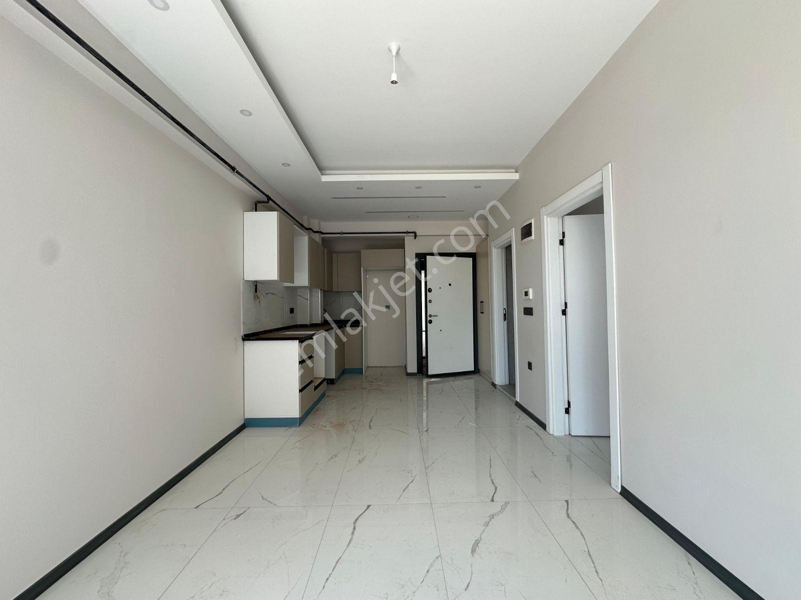 Tuğra'dan Havuzlu Site İçinde Yatay Mimari 1+1 Satılık Daire - Görsel 2