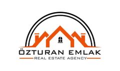 ÖZTURAN EMLAK Logo