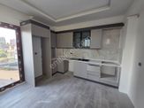 Karınca'dan Eski Mezitli'de Havuzlu İskanlı Ara Kat 2+1 Satılık!