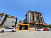 Redstone'dan Uysal Boulevard'da Cadde Cephe Satılık 1+1 Daire