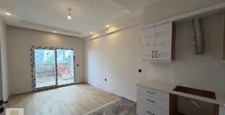 Kuşadası Güzelçamlıda Satılık Sıfır Yapım Bahçeli 1+1 Daire