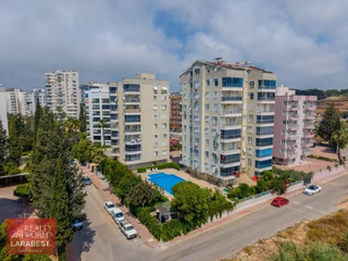 Güzeloba Örnekköyde Doğalgazlı Havuzlu Deniz Manzaralı 2+1