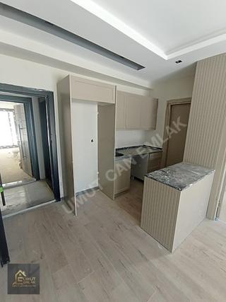 Ana Cadde Üzerinde Geniş Oturumlu Yatay Mimari 1+1 Daire