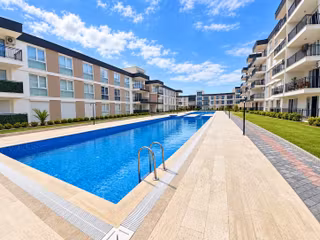 Kuşadası İkiçeşmelik 2+1 Havuz Cepheli Bahçe Katı Daire