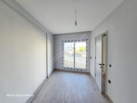 Kuşadası Davutlarda Yeni Binada 2+1 Bahçe Katı Daire