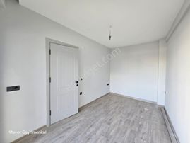 Kuşadası Davutlarda Yeni Binada 2+1 Bahçe Katı Daire