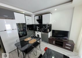 Güzeloba'da Artuklu Konutlarında 1+1 Giriş Katı