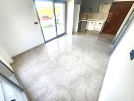 Burhaniye Ören'de Aygülden Sıfır Bahçe Kullanımlı Denize Yakın Ön Cephe Doğalgazlı 1+1 Satılık Daire