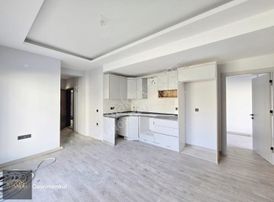 Kuşadası Davutlarda Yeni Binada 2+1 Bahçe Katı Daire