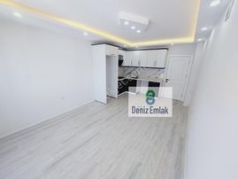 Denizden Akçayda Kapalı Otoparklı Yerden Isıtmalı Satılık 1+1 Daire.