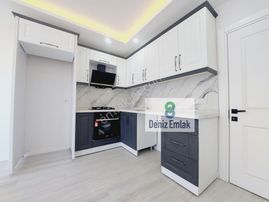 Denizden Akçayda Kapalı Otoparklı Yerden Isıtmalı Satılık 1+1 Daire.
