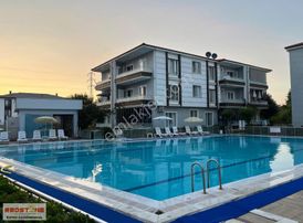 Havuzlu Sitede Ara Kat Kombili Cam Balkonlu 2+1 Satılık Daire