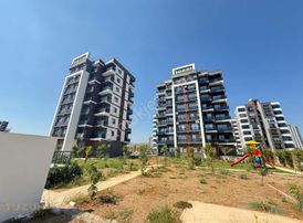 Tüzün'den Mezitli'de 2+1 Havuzlu Satılık Daire