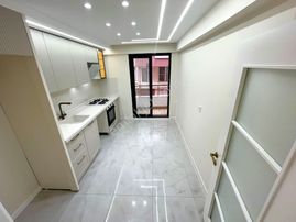 Aygül'den Akçay'da Merkezi Lokasyonda Özel Mimari Tasarım Ayrı Mutfak Çift Banyolu 3+1 Satılık Daire