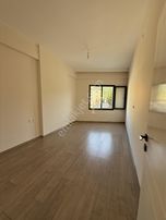 Davutlar'da Merkezi Konumda 2+1 Satılık Daire