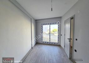 Kuşadası Davutlarda Yeni Binada 2+1 Bahçe Katı Daire