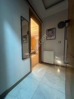 Nergizde Satılık 1+1 Geniş Daire Balkonlu, Merkezi, Genç Bina