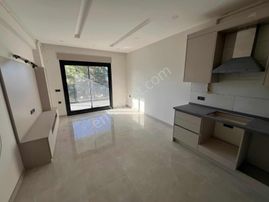 Kuşadası Kadınlar Denizinde Satılık Deniz Manzaralı 1+1 Daire