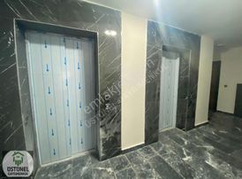 Üstünel'den Görüklede Sıfır Bina Sıfır Eşyalı 1+1 Satılık Daire