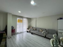 Güzelçamlı'da Satılık Geniş Teraslı 1+1 Merkezde Daire