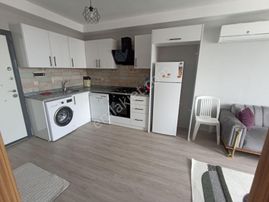 Atıcı'dan Belediye Yanında Kiracılı Eşyalı 1+1 Satılık Daire