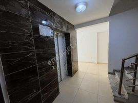 Kuşadası Davutlar Merkezde Satılık 2+1 Bahçe Katı Daire