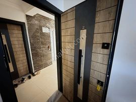 Kuşadası Davutlar Merkezde Satılık 2+1 Bahçe Katı Daire