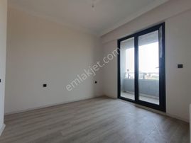 Sancak Emlaktan Kemalpaşada 1+1 Butun Cepheleri Acik Sifir Daire