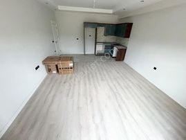 Yükselden Satılık Edremitte K.otoparklı Yüzme Havuzlu D.gazlı 1+1 Daire