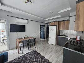 Karınca'dan Tecede Havuzlu Doğalgazlı Denize Yakın 1+1 Eşyalı