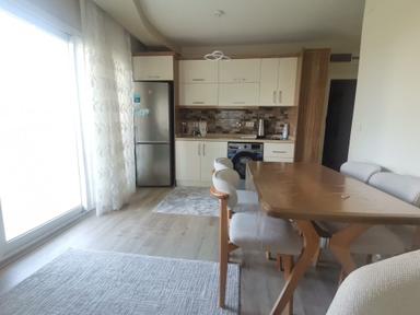 View Çiftlikköy | Eşyalı, Modern & Ferah 1+1 Kiralık Daire