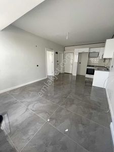 Stadyum~civarı~1+1~geniş~oturumlu~site~içerisi~lüx~işçilik~cazip