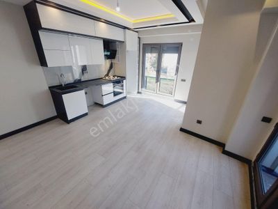 Denizden Akçayda Yerden Isıtmalı Asansörlü Harika Konumda Satılık 1+1 Daire.