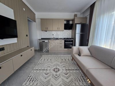 Kuşadası Davutlarda Satılık Eşyalı Bahçeli 1+1 Havuzlu Sitede