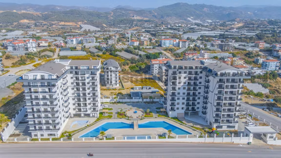 Fiyat Düştü! Alanya Payallar'da Satılık Full Aktiviteli Deniz Manzaralı 2+1 Daire 1